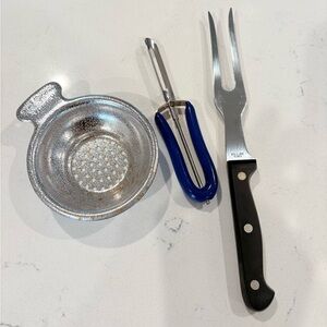 Silver Juice Strainer, Blue Peeler, and Black Fork Kitchen Tools